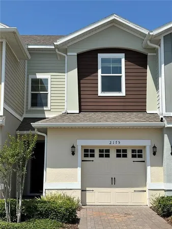 a front view of a house with a garage