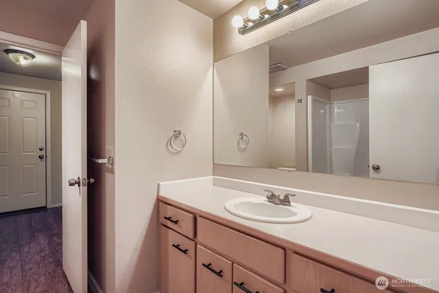 a bathroom with a sink and a large mirror
