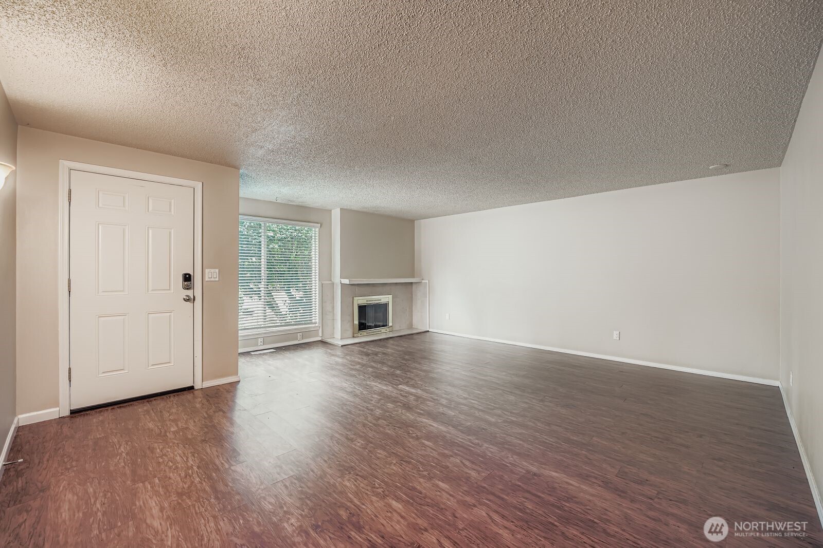 2738 Southwest 323rd Street Federal Way, WA 98023 - Photo 3 of 26 an empty room with wooden floor and windows