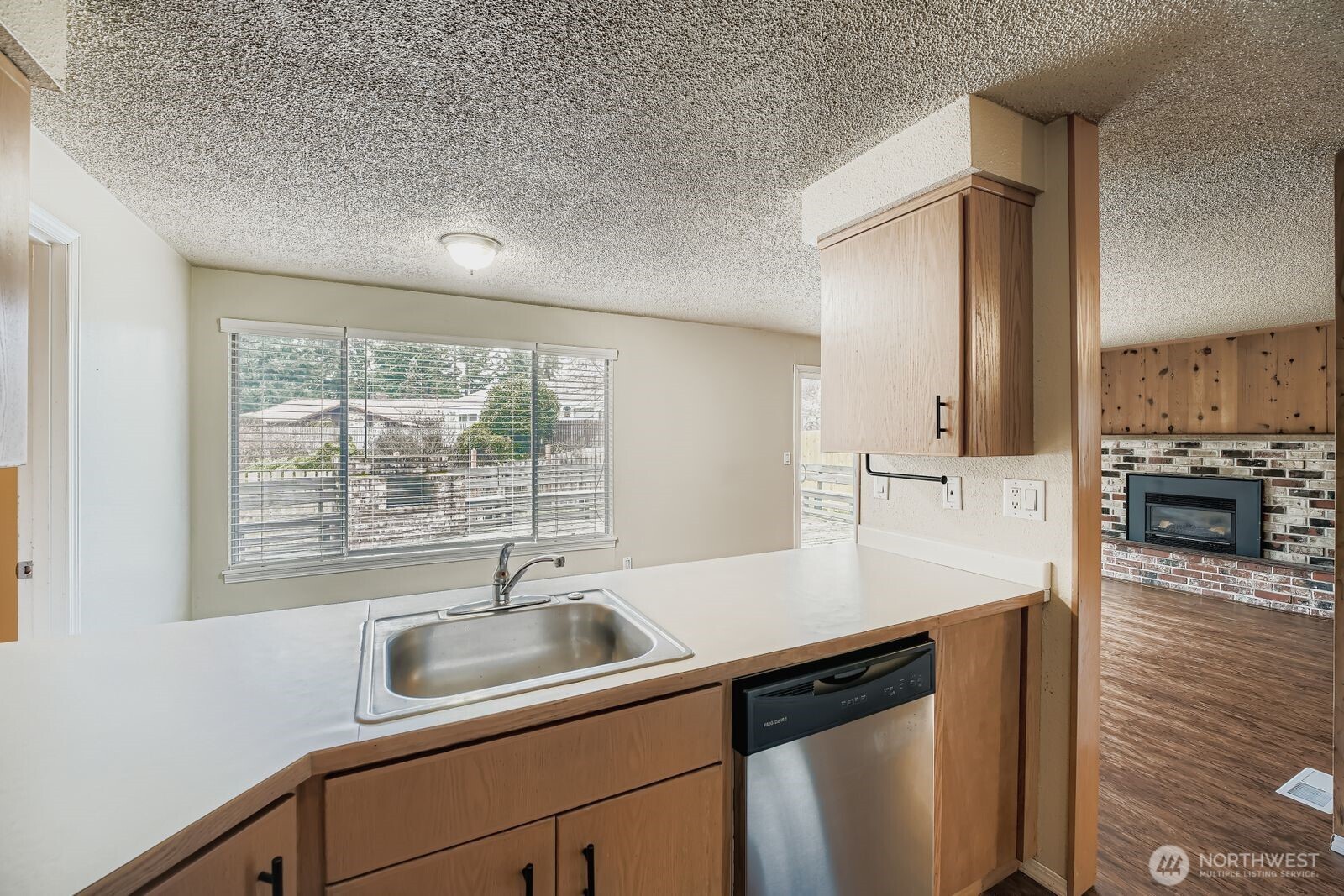 2738 Southwest 323rd Street Federal Way, WA 98023 - Photo 10 of 26 a close view of sink and cabinets