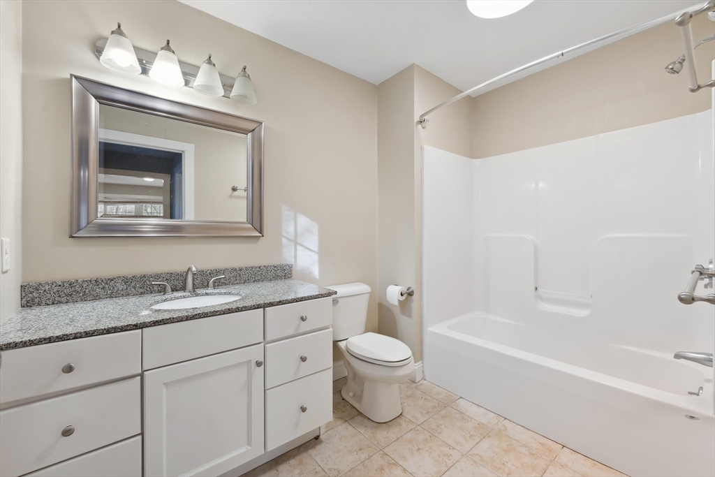 2 Pine Cone Lane East Freetown, MA 02717 - Photo 19 of 38 a bathroom with a granite countertop toilet a sink and bathtub