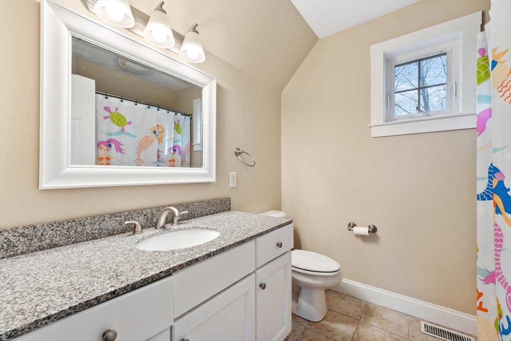 2 Pine Cone Lane East Freetown, MA 02717 - Photo 25 of 38 a bathroom with a granite countertop toilet a sink and mirror
