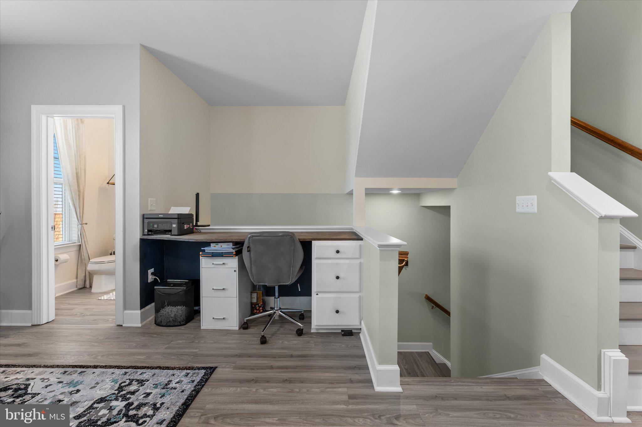 7075 Mongoose Trail Gainesville, VA 20155 - Photo 13 of 54 a workspace with furniture and wooden floor
