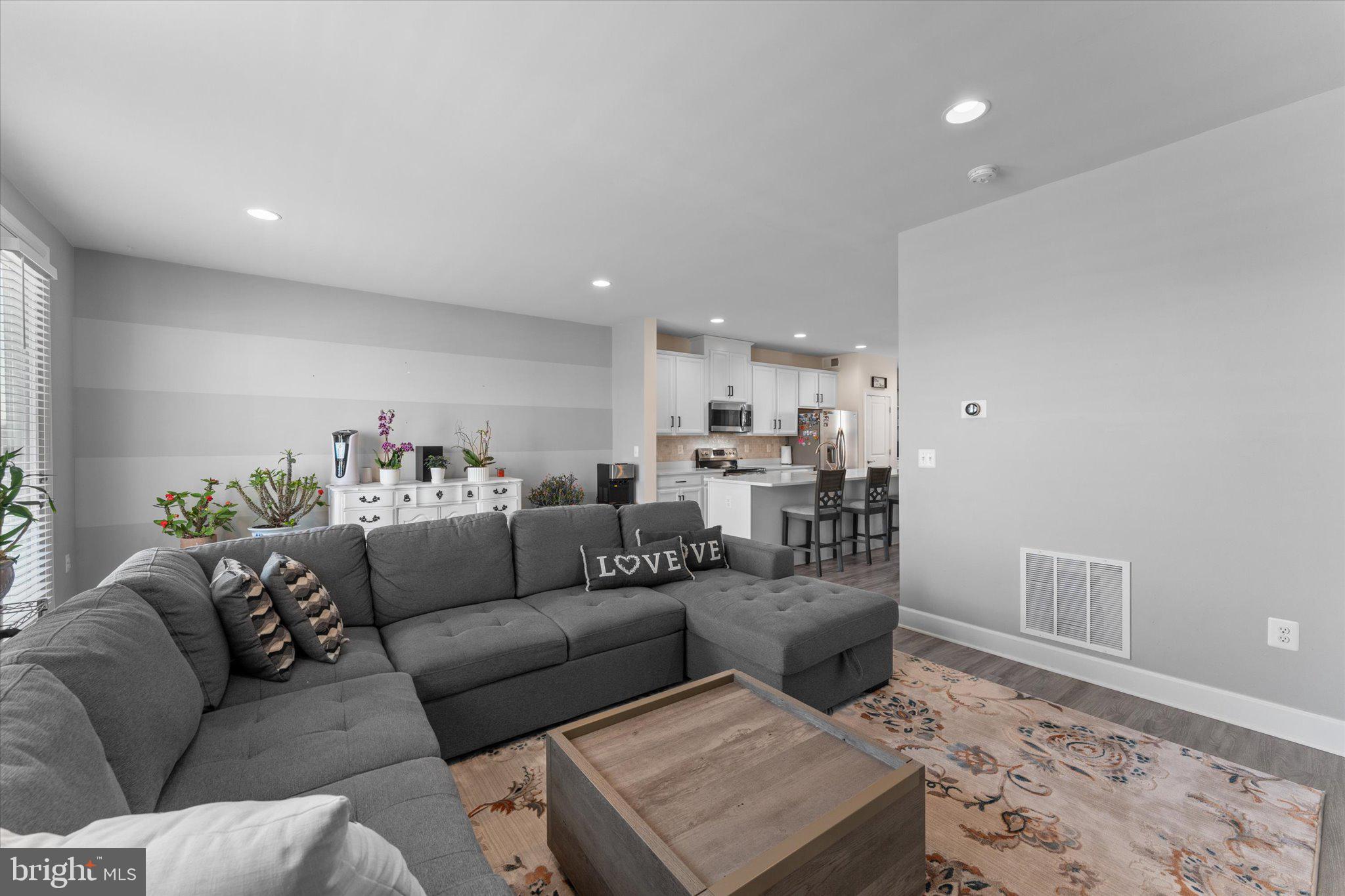 7075 Mongoose Trail Gainesville, VA 20155 - Photo 18 of 54 a living room with furniture and a rug