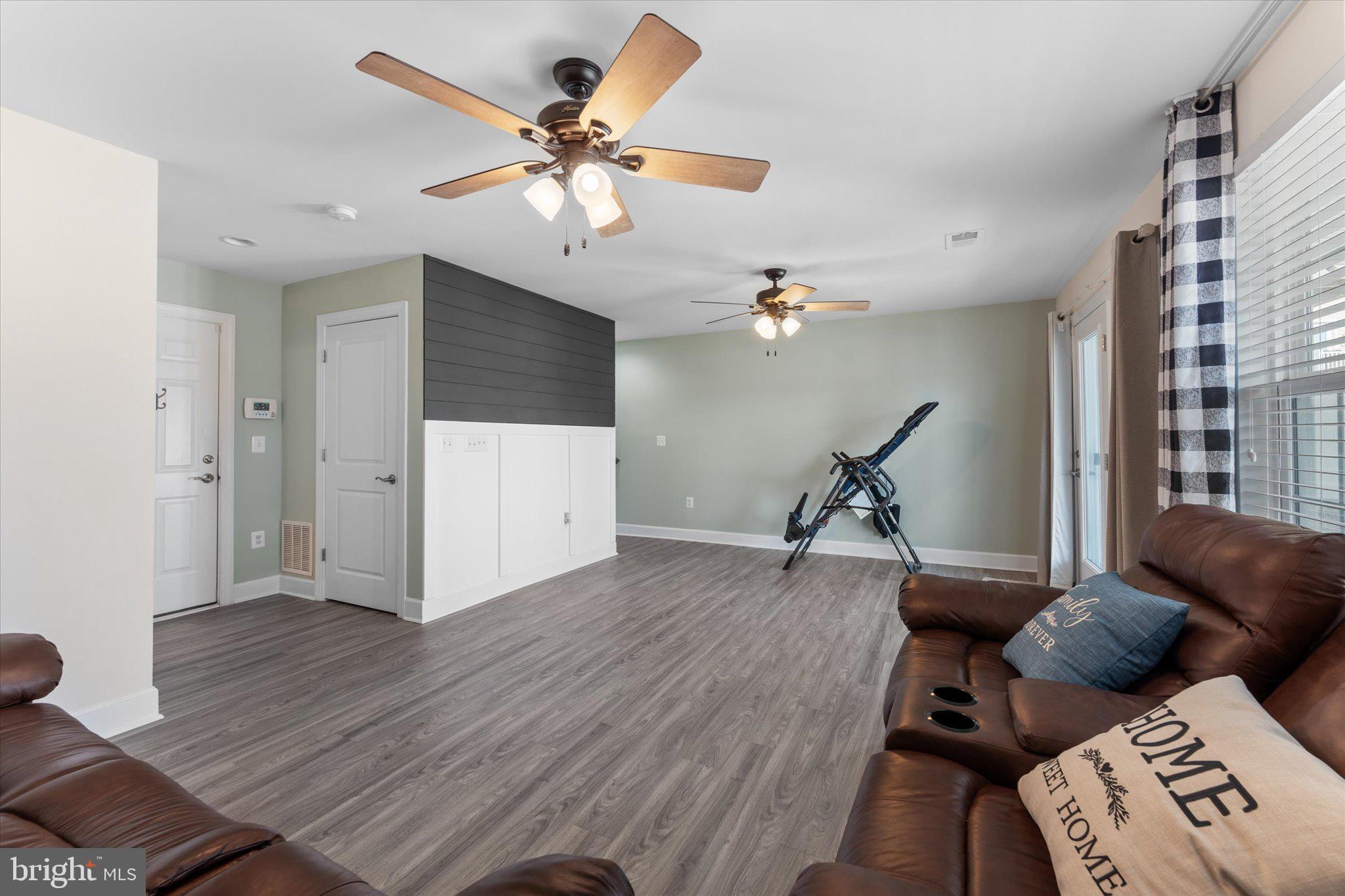 7075 Mongoose Trail Gainesville, VA 20155 - Photo 35 of 54 a living room with furniture and a wooden floor