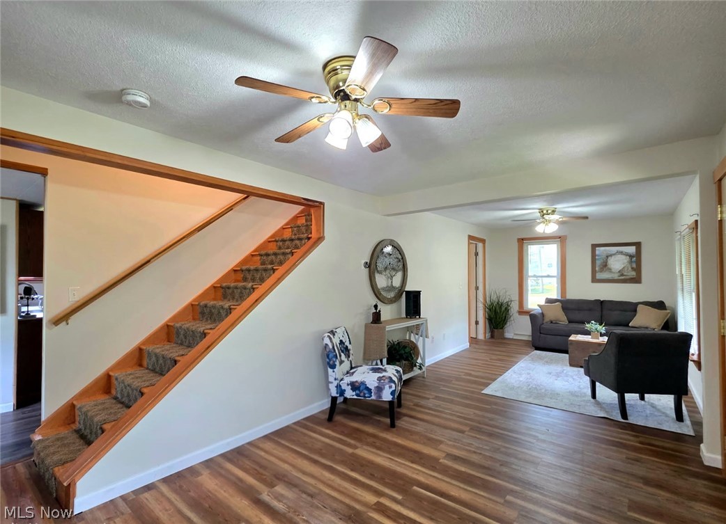 2335 West River Road Newton Falls, OH 44444 - Photo 3 of 36 Entry area featuring a staircase with carpeted treads and wood-finish flooring