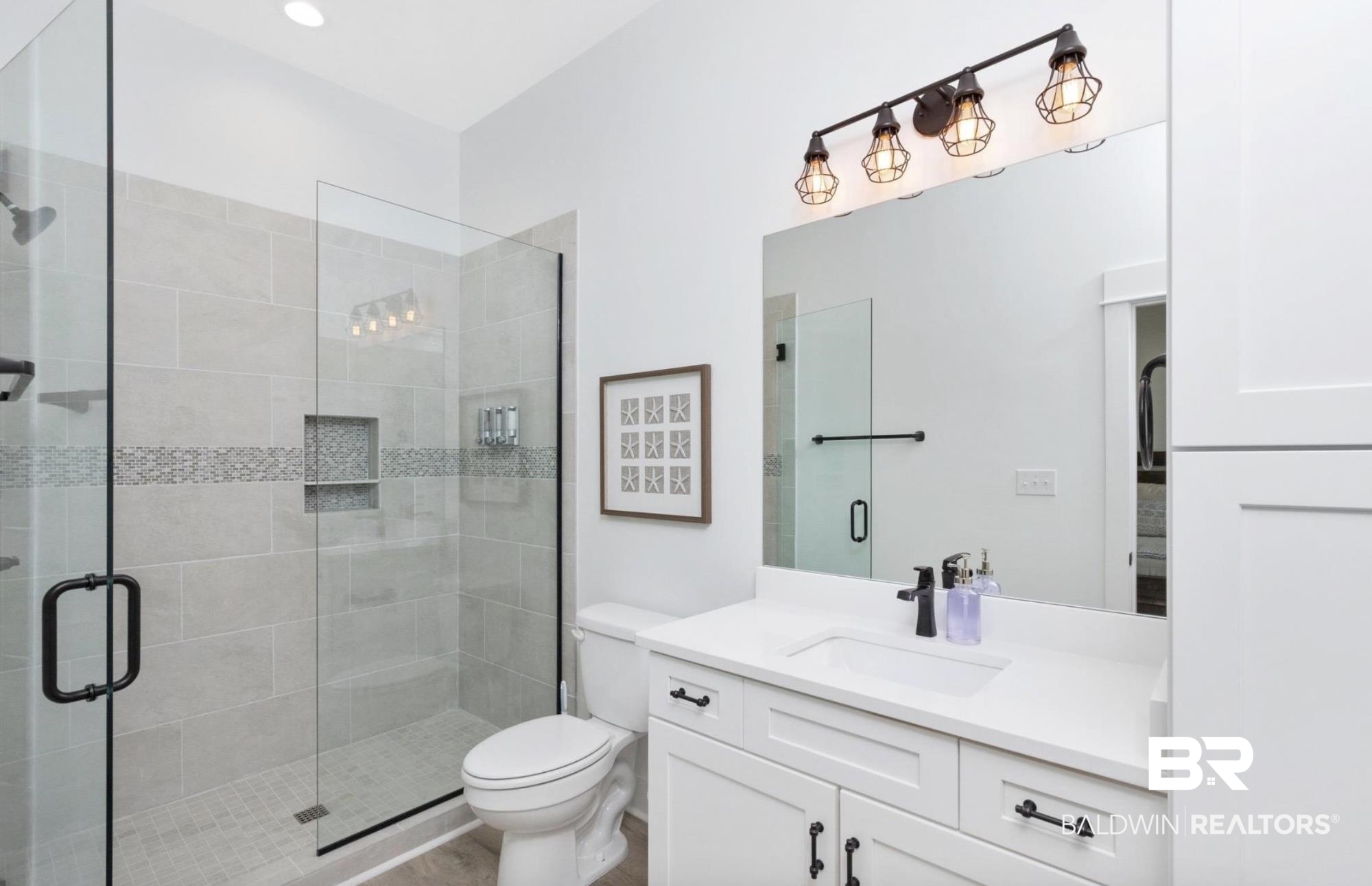 20 West Gate Orange Beach, AL 36561 - Photo 11 of 15 Bathroom featuring vanity and a shower stall