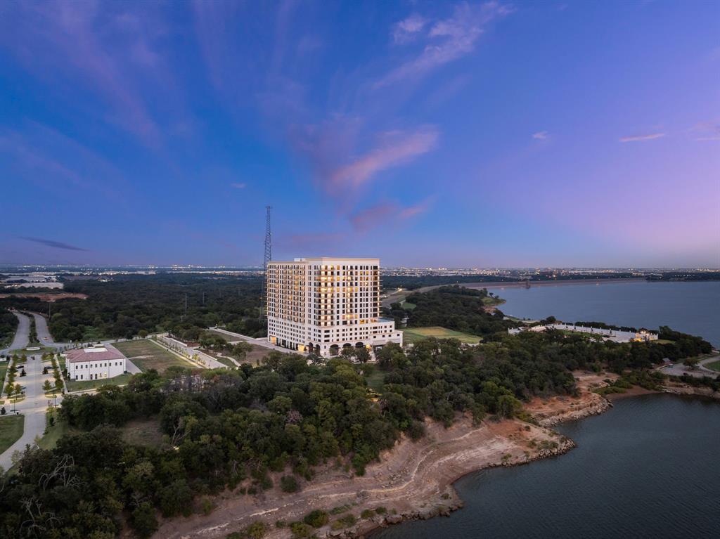 3111 Sunset Boulevard, Unit 1409 Flower Mound, TX 75022 - Photo 35 of 37 a view of a lake with a building in front of it