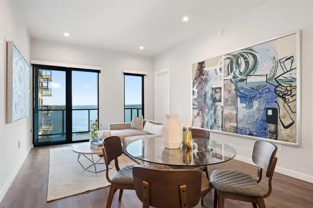 a view of a dining room with furniture window and wooden floor