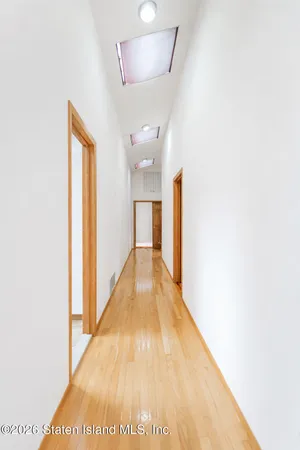 wooden floor and window in an empty room