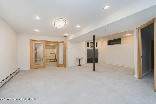 a living room with furniture and large window