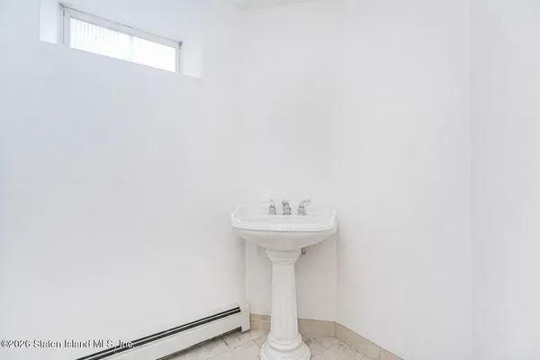 a view of a hallway with washer and dryer