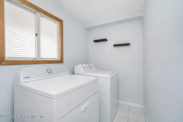 a kitchen with granite countertop a sink a counter appliances and cabinets