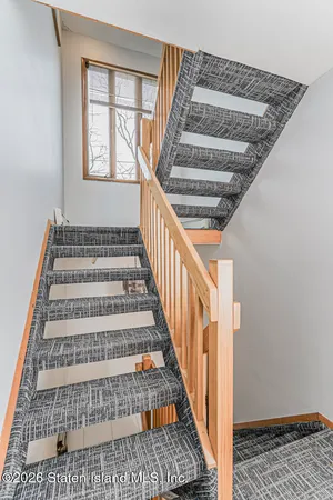 a kitchen with granite countertop white cabinets and appliances