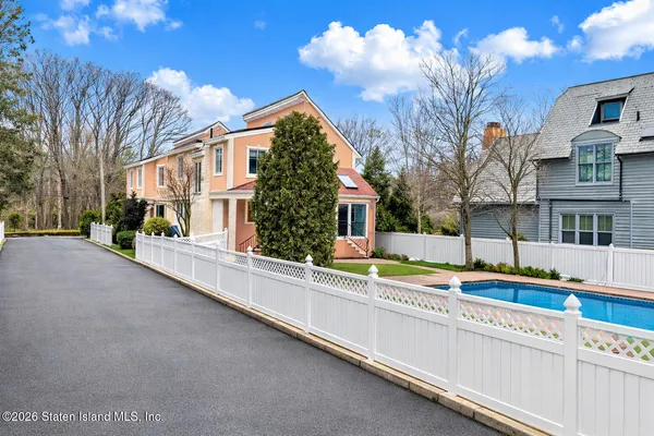 a view of a house with a large trees
