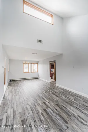 a bathroom with a toilet sink vanity and mirror