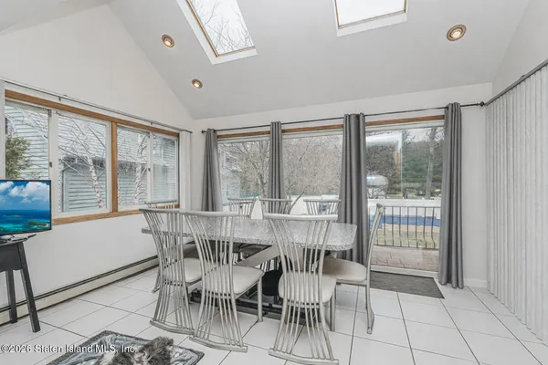 a view of a dining room with furniture window and outside view