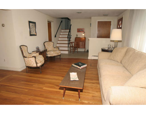 86 Noanett Road Needham, MA 02494 - Photo 3 of 9 a living room with furniture and a lamp