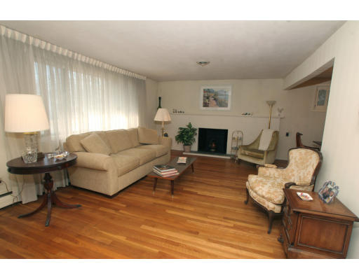 86 Noanett Road Needham, MA 02494 - Photo 4 of 9 a living room with furniture and a fireplace