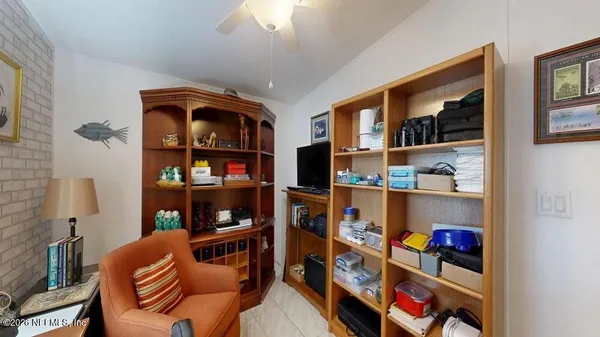 a shelf with books and knick knacks on it