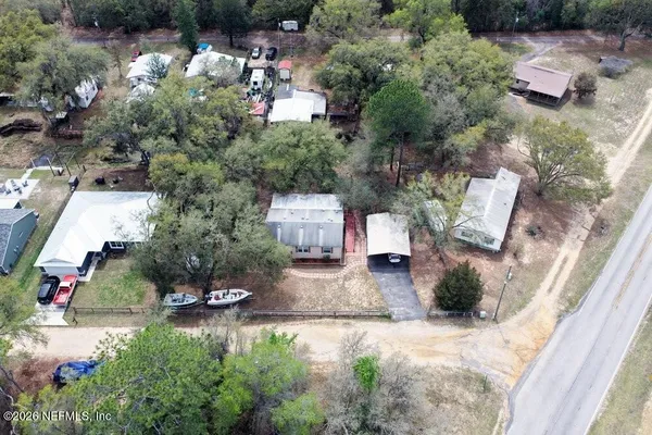 an aerial view of a house with outdoor space