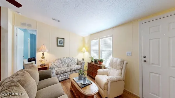 a living room with furniture and a large window