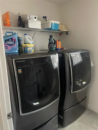 a bathroom with a granite countertop toilet sink and mirror