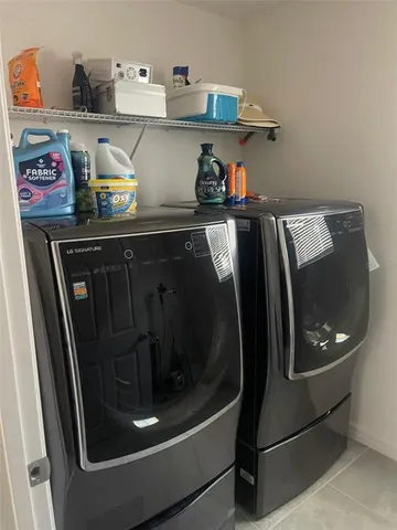 a bathroom with a granite countertop toilet sink and mirror