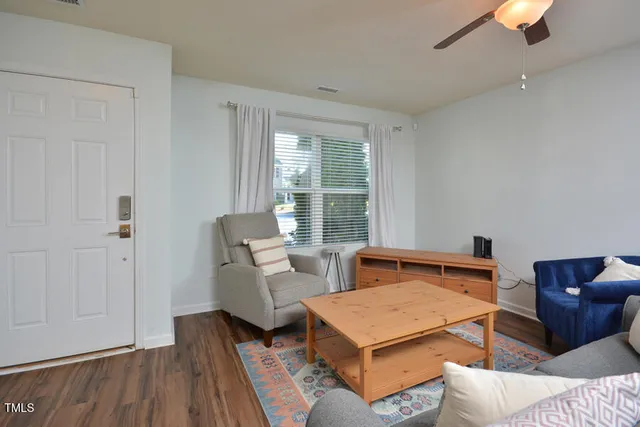 a bedroom with furniture and wooden floor