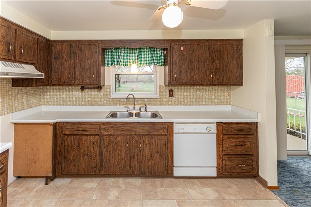 673 Vanderbilt Road Connellsville, PA 15425 - Photo 12 of 28 a kitchen with cabinets appliances and a counter space