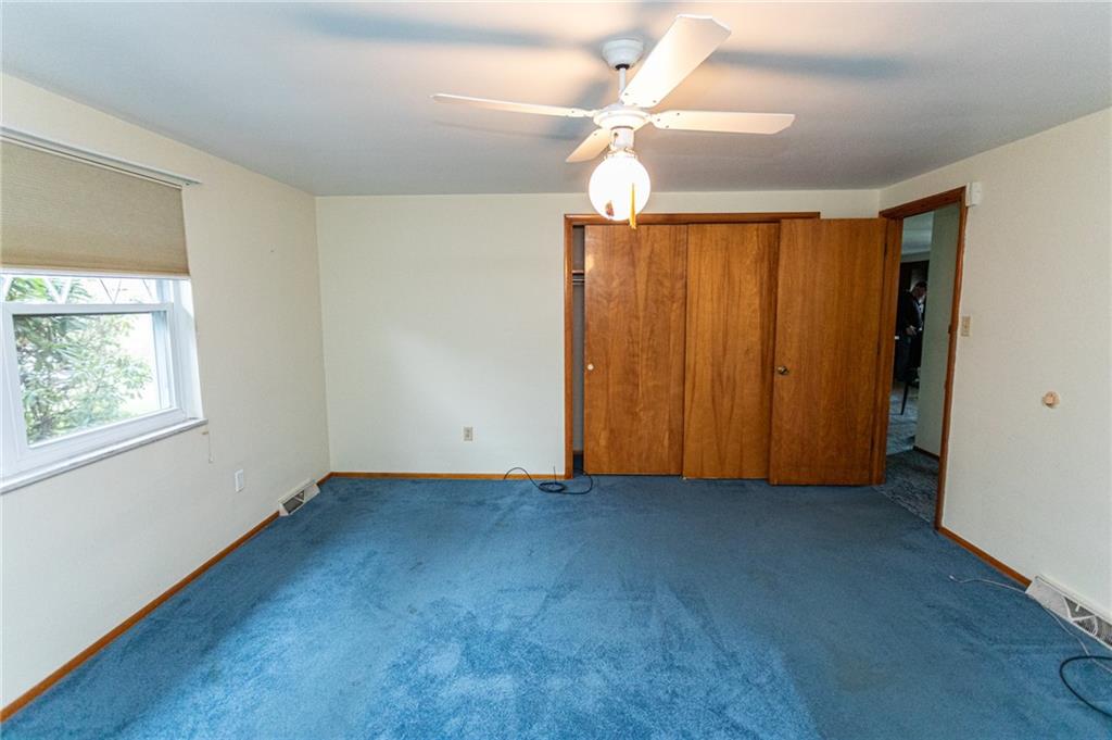 673 Vanderbilt Road Connellsville, PA 15425 - Photo 17 of 28 an empty room with windows and fan