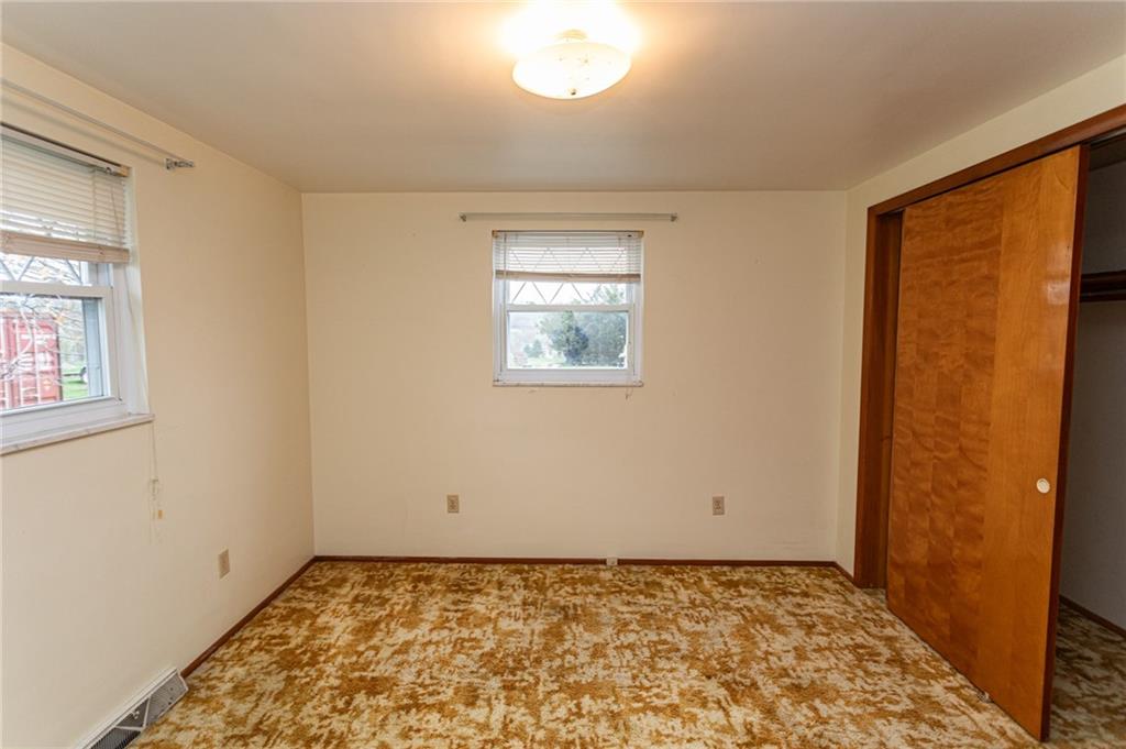 673 Vanderbilt Road Connellsville, PA 15425 - Photo 21 of 28 a view of an empty room and window