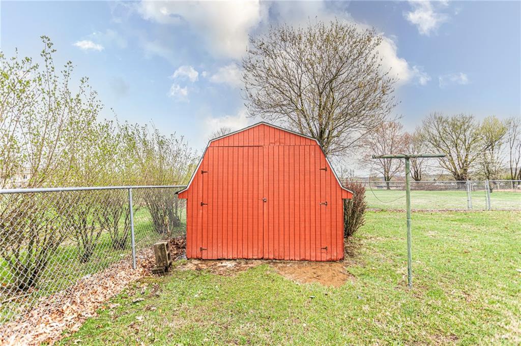 673 Vanderbilt Road Connellsville, PA 15425 - Photo 26 of 28 a view of a backyard with a garden and entertaining space