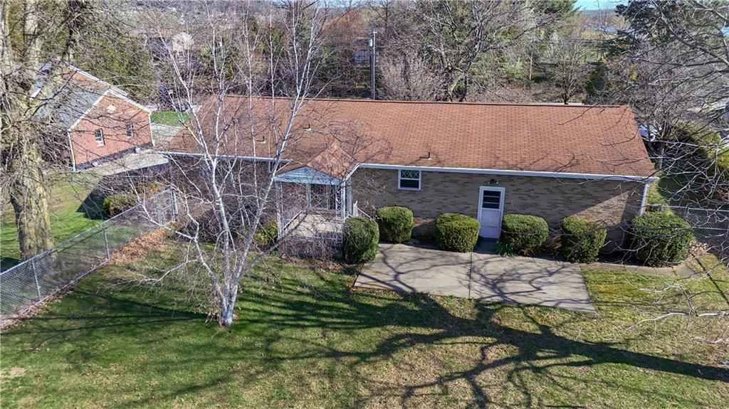 673 Vanderbilt Road Connellsville, PA 15425 - Photo 7 of 28 a view of a house with a yard