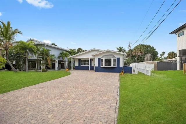 a view of house with outdoor space and yard