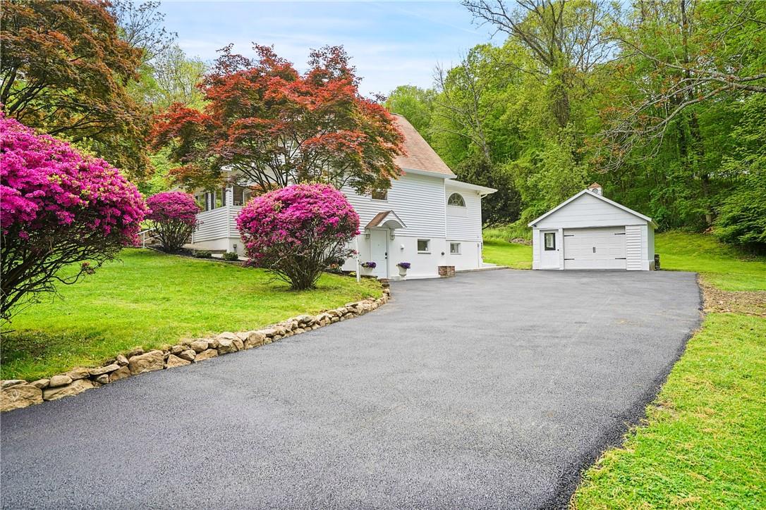 24 Butler Hill Road Somers, NY 10589 - Photo 1 of 1 a front view of a house with garden