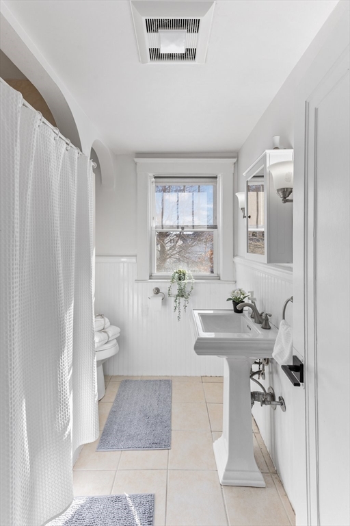 7 Cedar Terrace Milton, MA 02186 - Photo 16 of 34 a room with a white couch and a window