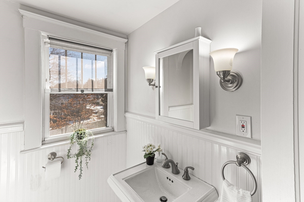 7 Cedar Terrace Milton, MA 02186 - Photo 17 of 34 a bathroom with a sink and a mirror