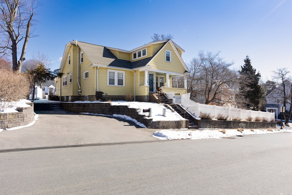 7 Cedar Terrace Milton, MA 02186 - Photo 2 of 34 a front view of a house with a yard