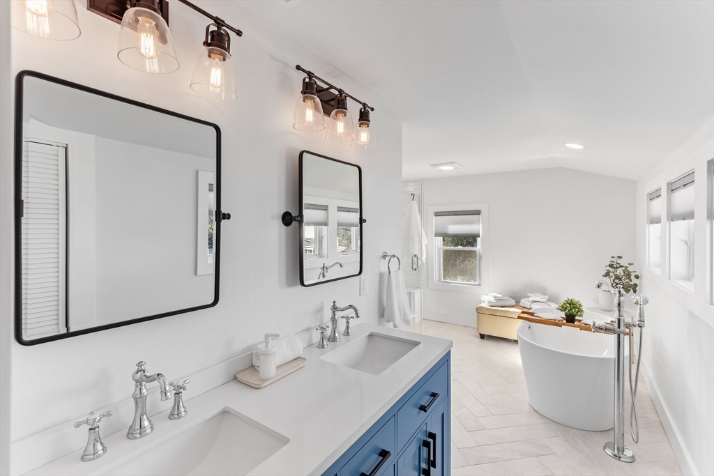 7 Cedar Terrace Milton, MA 02186 - Photo 21 of 34 a bathroom with a double vanity sink mirror and bathtub