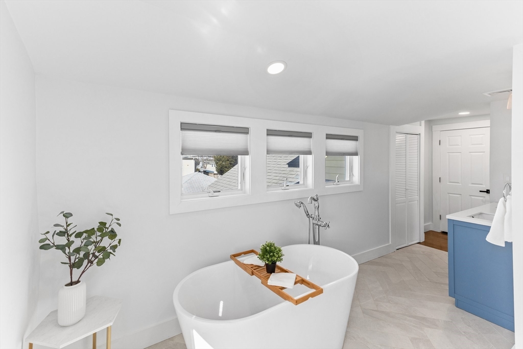 7 Cedar Terrace Milton, MA 02186 - Photo 23 of 34 a bath room with a bathtub and a sink