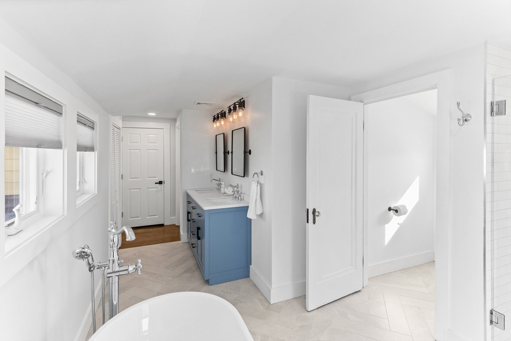 7 Cedar Terrace Milton, MA 02186 - Photo 24 of 34 a bathroom with a granite countertop sink mirror vanity and toilet