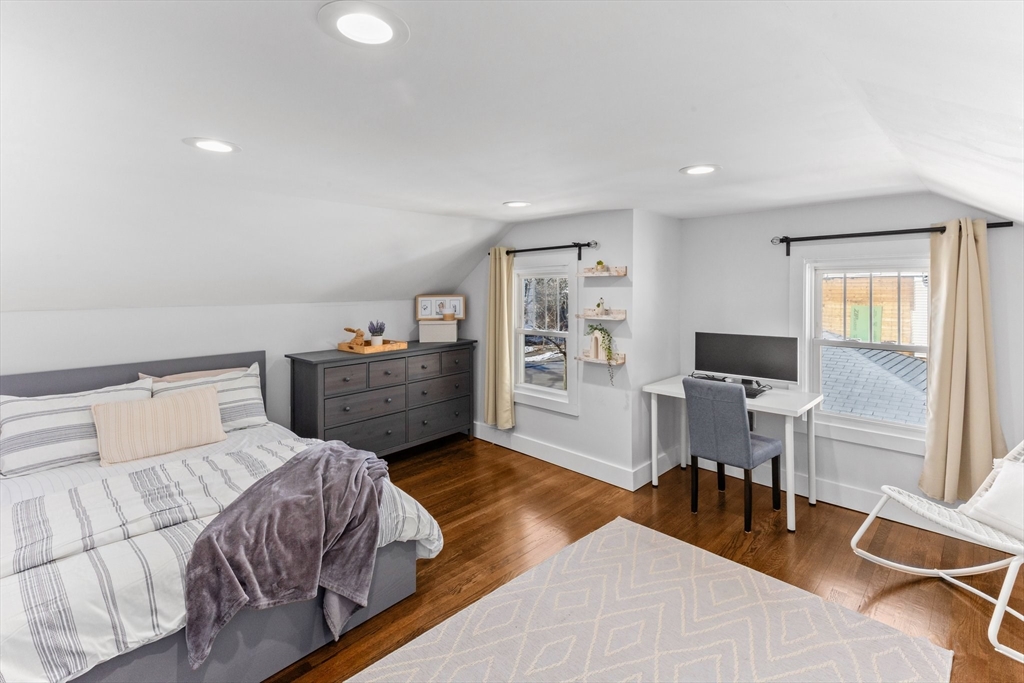 7 Cedar Terrace Milton, MA 02186 - Photo 25 of 34 a bedroom with a bed and a table in it