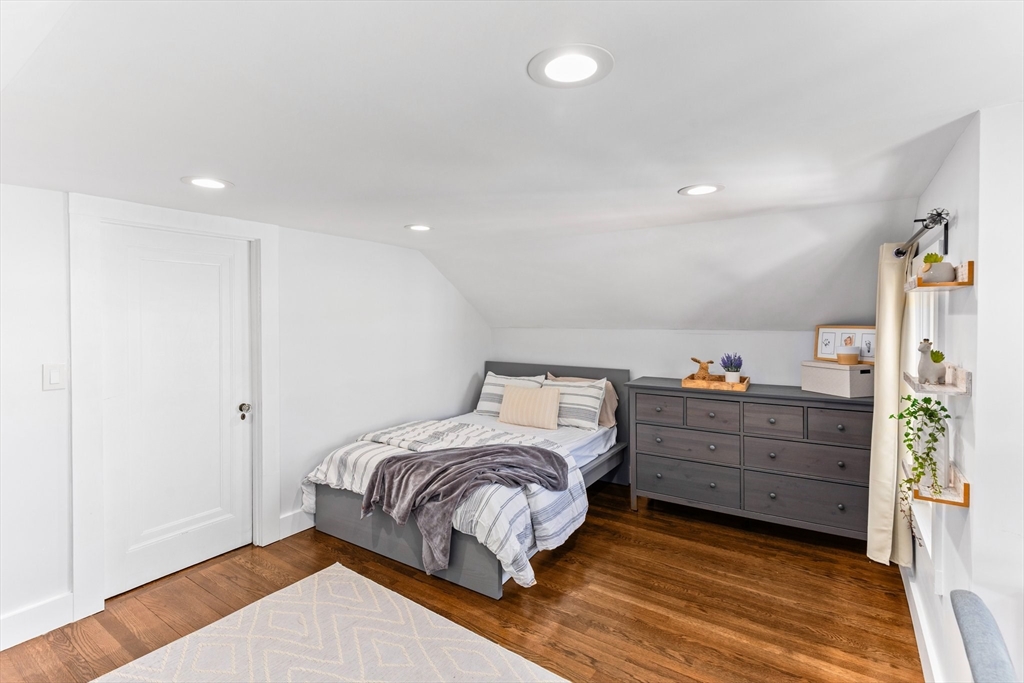 7 Cedar Terrace Milton, MA 02186 - Photo 26 of 34 a bedroom with a bed and a window