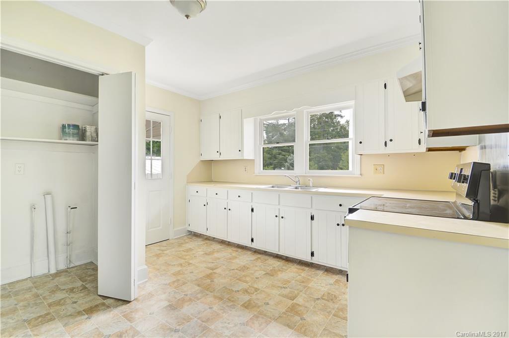 1297 Pinewood Road Rock Hill, SC 29730 - Photo 3 of 15 a view of a kitchen with sink cabinets and window