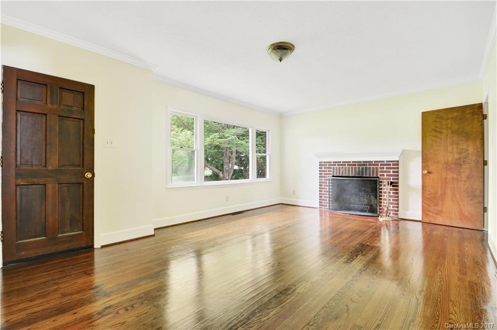 1297 Pinewood Road Rock Hill, SC 29730 - Photo 7 of 15 an empty room with wooden floor and windows