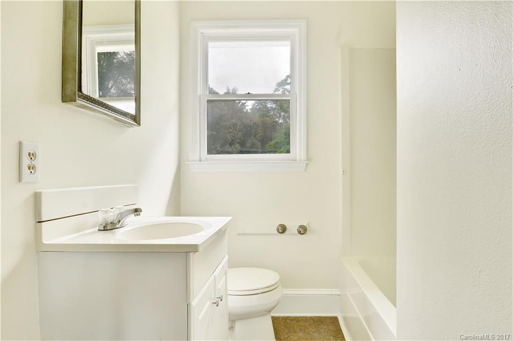 1297 Pinewood Road Rock Hill, SC 29730 - Photo 8 of 15 a bathroom with a sink mirror and toilet