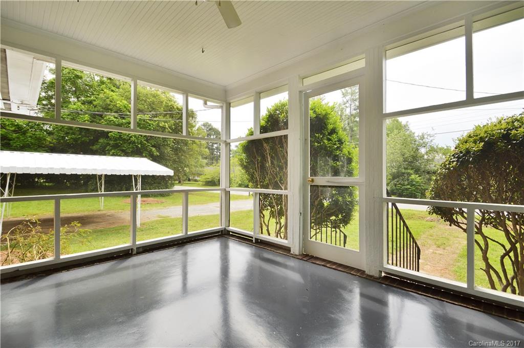 1297 Pinewood Road Rock Hill, SC 29730 - Photo 9 of 15 a view of an empty room with wooden floor and windows