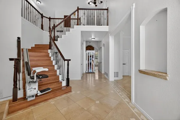 a view of staircase with white walls and window