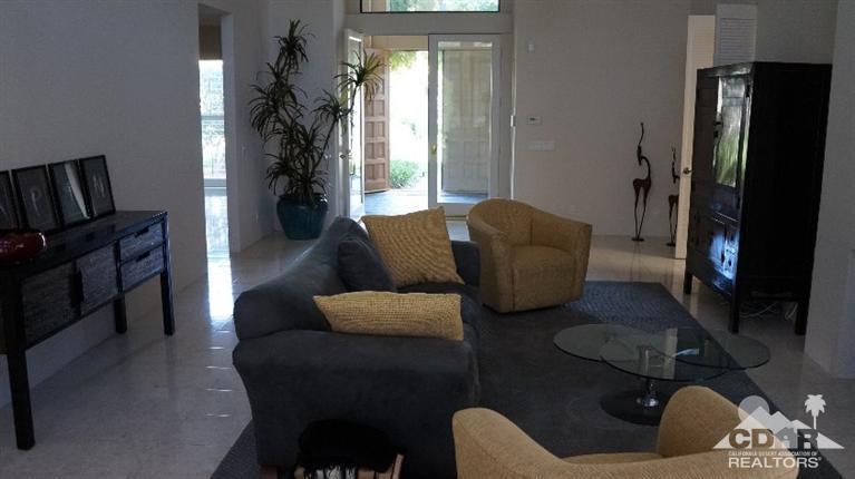 2 Lincoln Place Rancho Mirage, CA 92270 - Photo 11 of 25 a living room with furniture and a flat screen tv